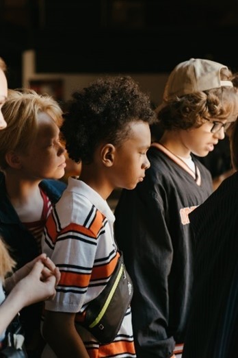 Male teen in a crowd of other teens